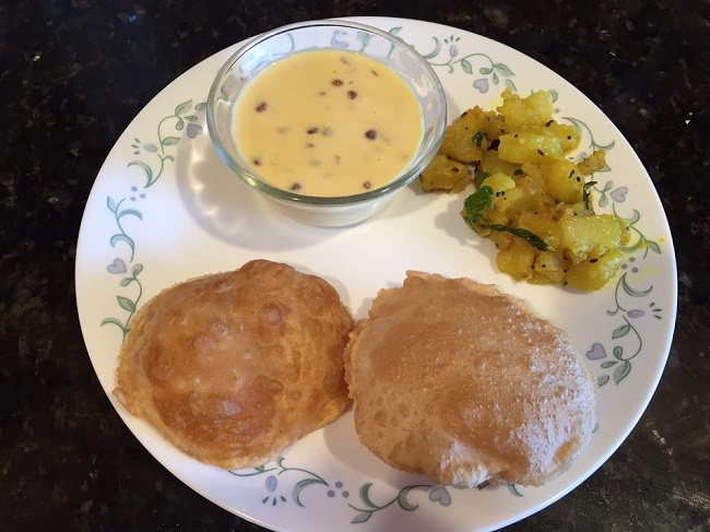 Potato dry veggie, puri and condensed milk